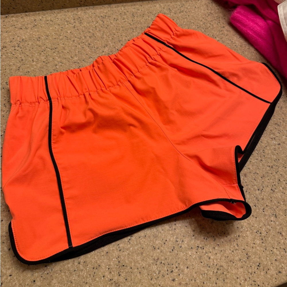 FP free people movement orange nylon athletic shorts black trim size small